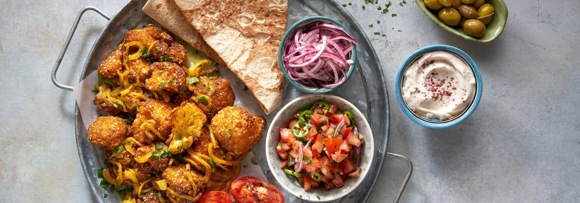 שווארמה כרובית עם סלטון של עגבניות בלאפה  | טבעול